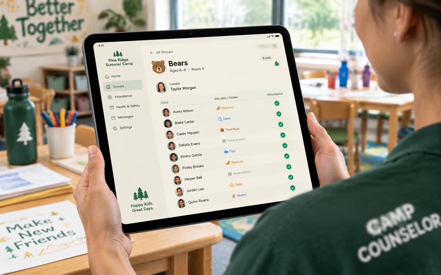 Counselor holding a tablet class roster